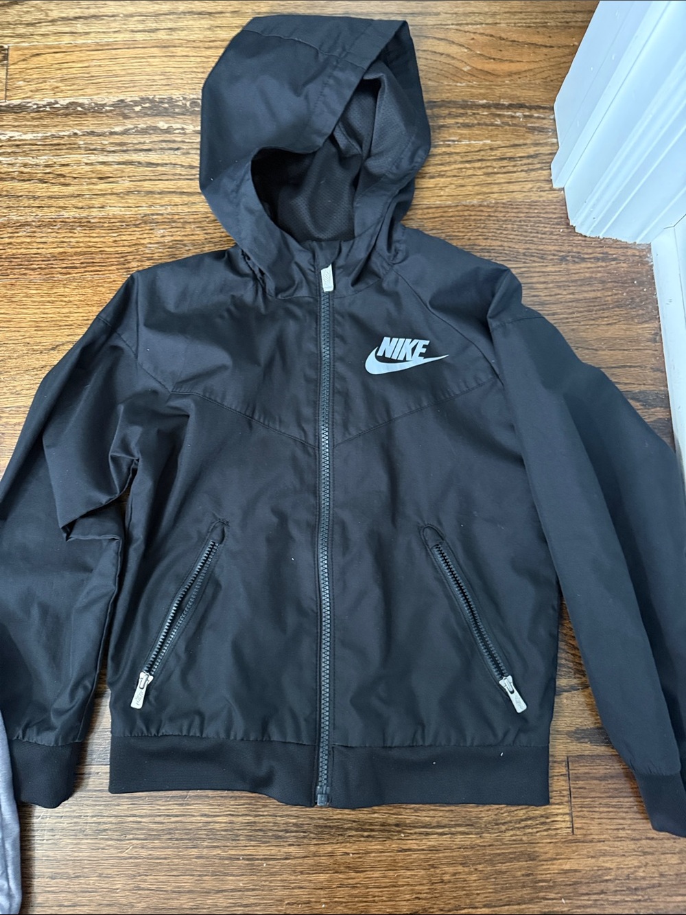 1 Nike Silver and 1 black Hooded Windbreaker Jacket.  $10 each